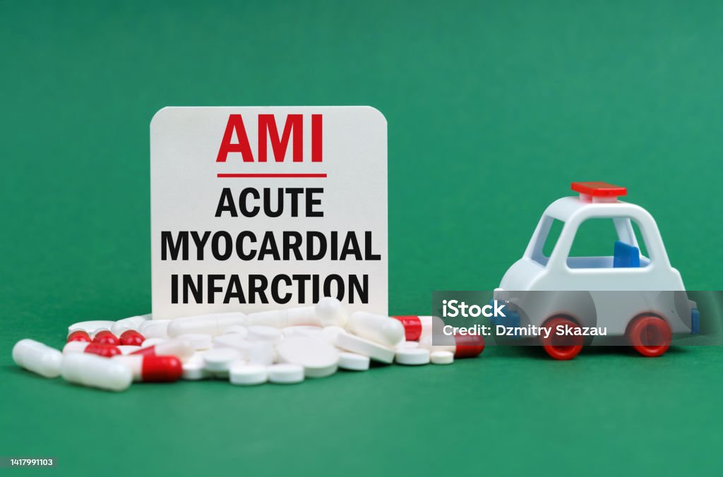 On a green surface, an ambulance, pills and a white sign with the inscription - Acute myocardial infarction Medical concept. On a green surface, an ambulance, pills and a white sign with the inscription - Acute myocardial infarction Acute Angle Stock Photo