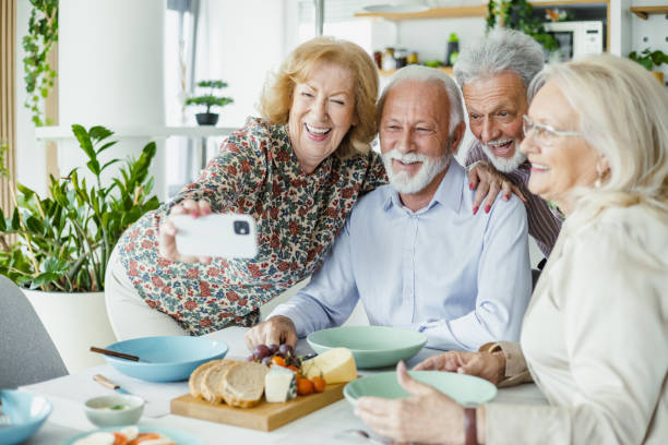istock Senior group of friends taking selfie during lunch 1417991300