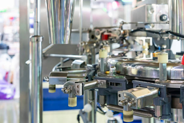 istock Detail component parts automatic bottle capping machine for continuous in manufacturing process 1417996028