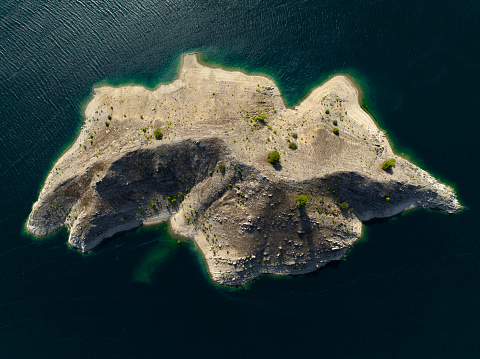 A small island in the middle of lake in Antalya, Turkey. Taken via drone.