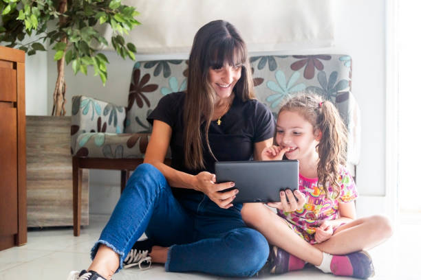 istock Mother and daughter at home 1417997175