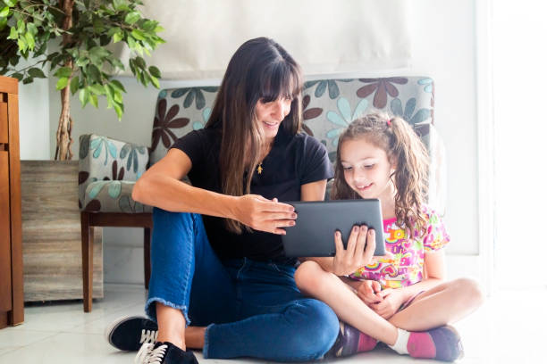 istock Mother and daughter at home 1417997345