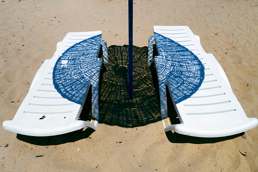 Sunbed And Beach Umbrella On Sand