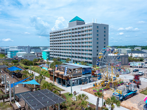 Carolina Beach, North Carolina, June 24 2021: Aerial View of a Hotel, Boardwalk, and Ferris Wheel At Carolina Beach in North Carolina