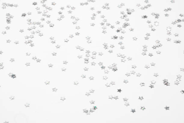 istock sparkles silver stars on white background with text place- Image 1418000001