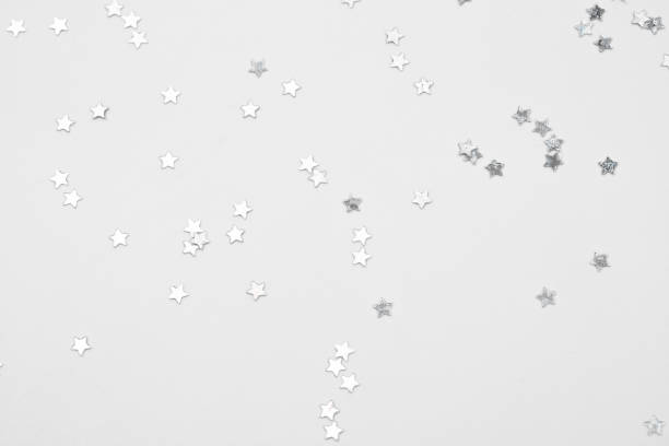 istock sparkles silver stars on white background with text place- Image 1418000006