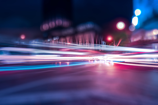 The motion of Traffic with light trails Abstract background for Digital Innovation technology in  blue and purple color