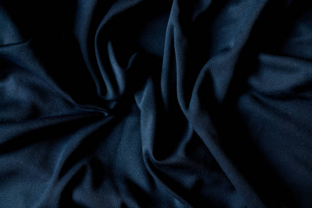 istock dark blue wrinkled fabric as background, blue fabric background, backgrounds 1418004706
