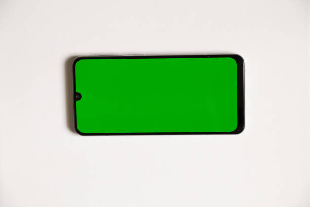 istock phone with green screen on isolated background, phone, place for text template 1418009177