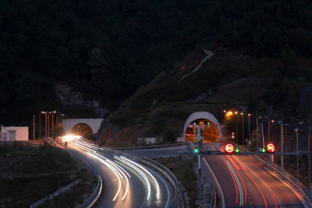 Light trails on road tunnel stock photo