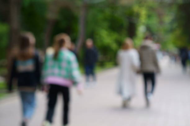 istock Blurred background. People in a public city park. 1418009677