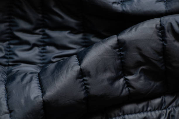 istock blue down fabric of a winter men's jacket as a background, blue fabric, a winter jacket as a background, outerwear 1418010464