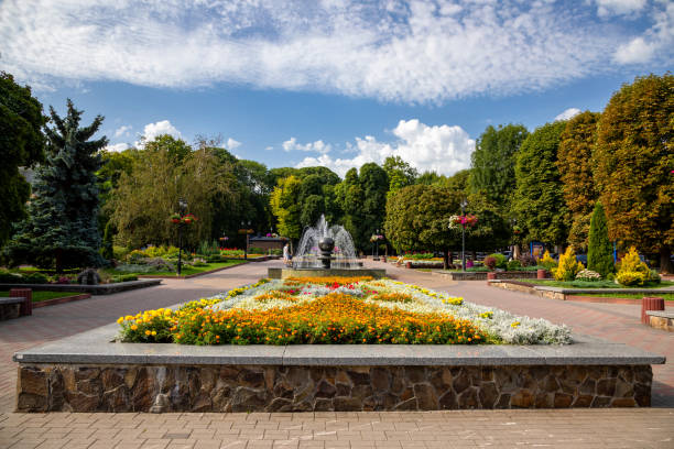 istock Summer park in the city of Khmelnytskyi. Square with a fountain. 1418017575