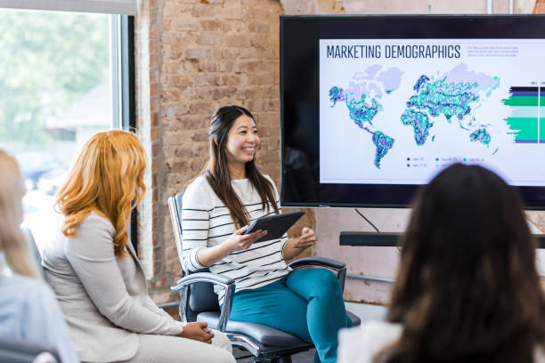 istock Meeting facilitator helps to introduce the speaker 1418017742