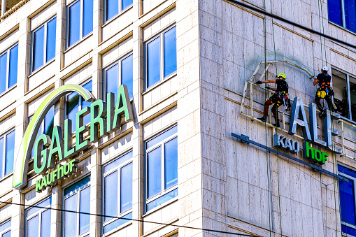 Munich, Germany - August 22: The logo of the department store chain Galeria Kaufhof, which is closing this branch, at Stachus (Karlsplatz) in Munich on August 22, 2022