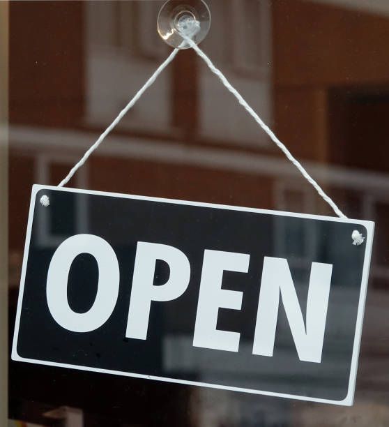 istock An open sign hanging in a cafe window. 1418018111