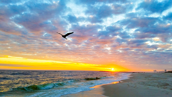 Dramatic Winter Sunset on the beach at Alabama Point, Orange Beach, Alabama, Gulf of Mexico