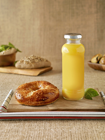 Fresh pastries and orange juice on a table setting