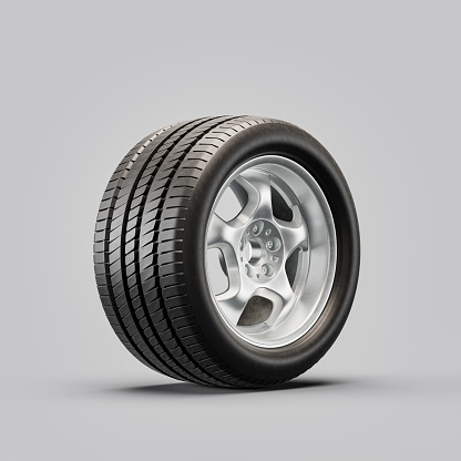 Car wheel on white background. Isolated car tire with shiny rim from side view. 3d rendering, nobody