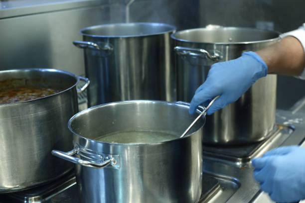 istock saucepan of boiling soup on oven in a restaurant kitchen 1418025438