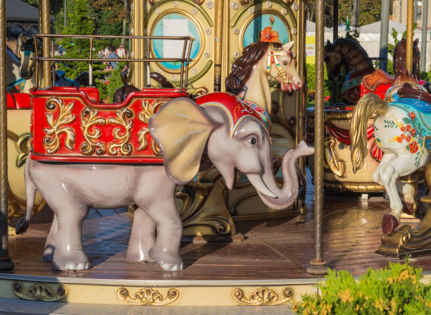 old carousel colorful elephant in golden evening light