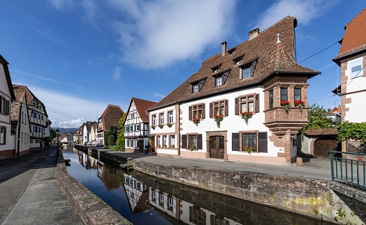Wissembourg, France, October 13, 2020: View of a water canal in this Alsatian town on a sunny autumn day. The town is situated on the little River Lauter close to the border between France and Germany.