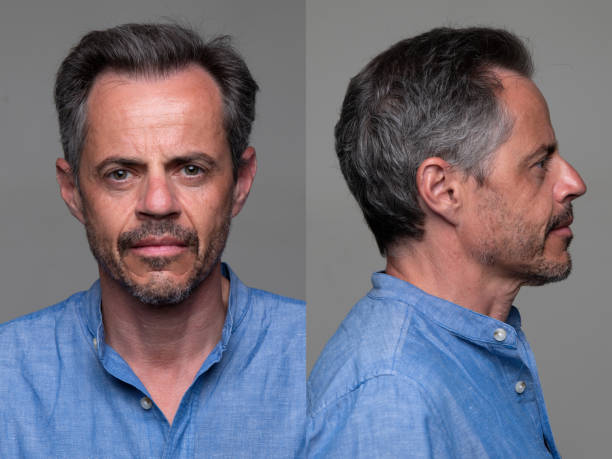 Serious Man front and profile mugshots stock photo