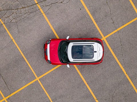 Car parked at parking lot of the airport for rental. Aerial view of car parking lot of the airport. Used luxury car for sale and rental service. Automobile parking space. Car dealership concept.