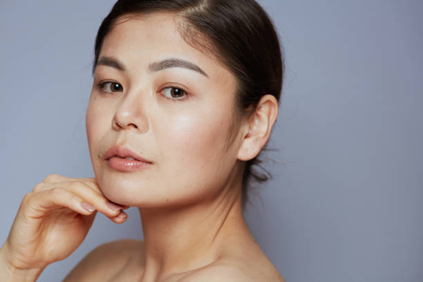 istock modern asian female on blue 1418029617