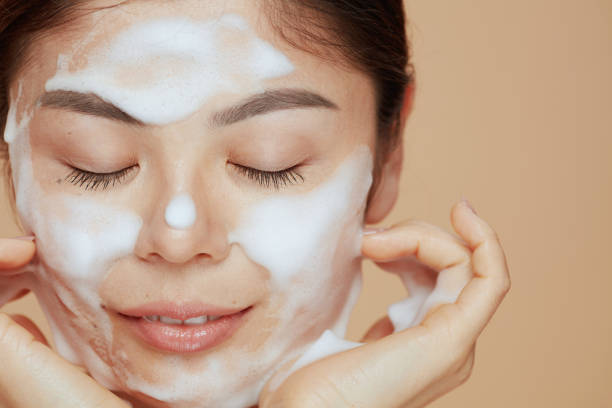 istock modern asian female washing face 1418029629