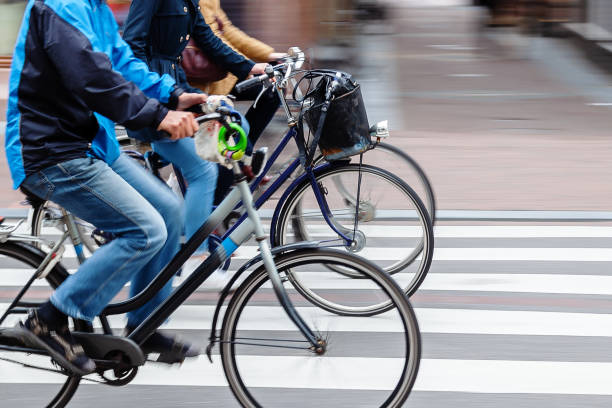 istock people riding bicycle in the city 1418030571