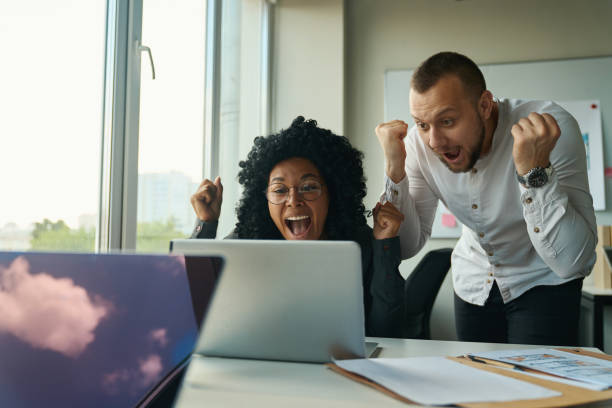 istock Managers at the computer rejoice at the promotion 1418031381