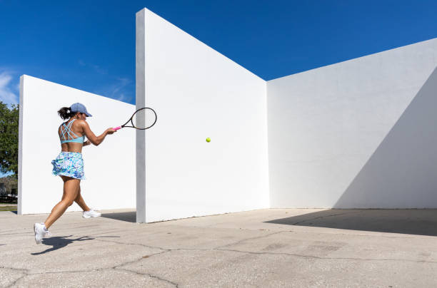 istock Female tennis player practicing on handball court 1418031548