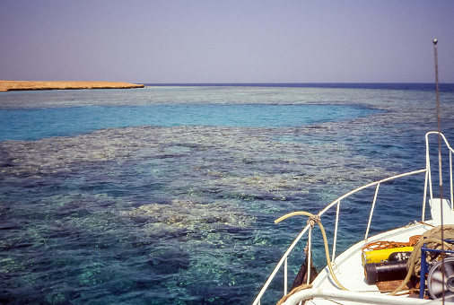 Hurghada, Egypt - aug 16, 1991: a boat moored in front of the Giftun Island reef, off the coast of Hurghada