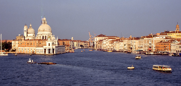 Arriving on a cruise ship,  Canal Grande  enters the islets and alleys of Venice, the pearl of the Adriatic.