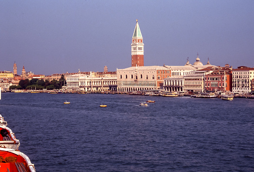 Arriving on a cruise ship, the bell tower of San Marco rises above the lagoon city of Venice