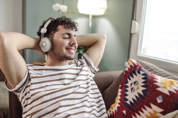 istock Young man relaxing at home 1418034075
