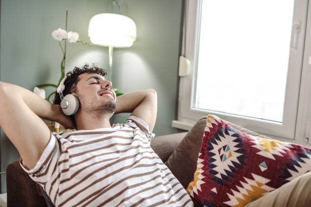 istock Young man relaxing at home 1418034085