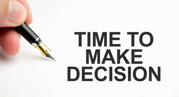 istock TIME to make decision words on paper with pen 1418035483