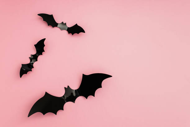 istock Bat silhouettes on pink background with copy space. 1418037316