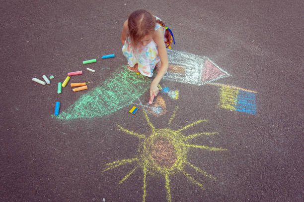 istock Child from Ukraine draws with chalk. 1418037339