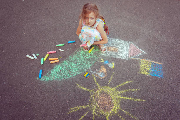 istock Child from Ukraine draws with chalk. 1418037372