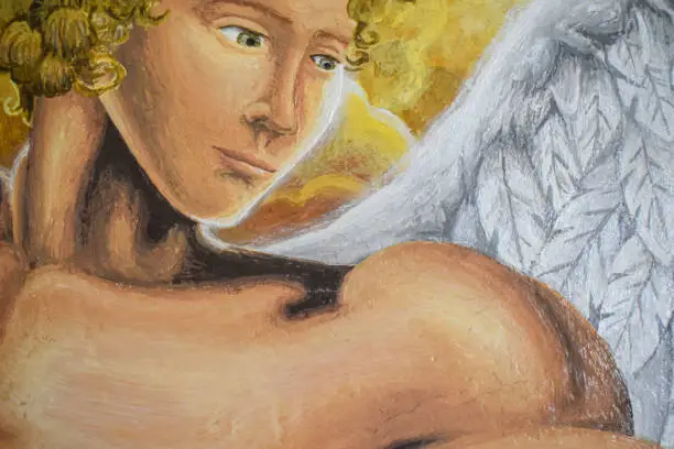 Close up of a beautiful picture of an angel in heaven. Section of a painting about an angel. Oil on canvas.