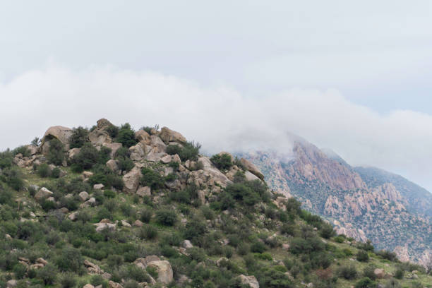 istock Fog Claws its Way Over Jagged Teeth, Aguirre Springs, Monsoon Season 1418047476