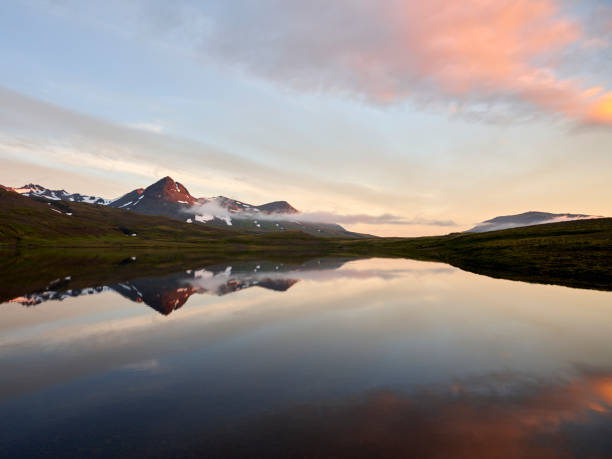 istock Mountain lake reflecting clouds in morning 1418050617
