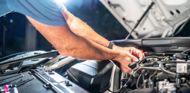 istock Auto mechanic working in garage. Repair service. 1418051502