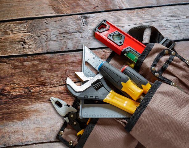 istock Carpenter tools on wood background. Wide. Top view. 1418057070