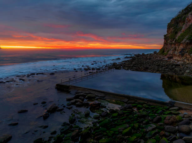 istock Cloud filled sunrise seascape with sea pool 1418057517