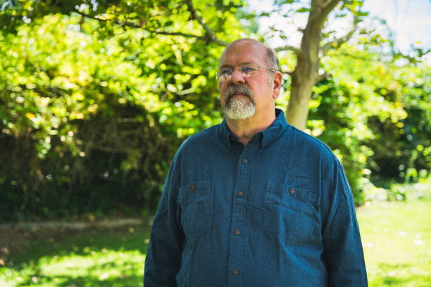 istock Middle Aged Man in Nature with a Hopeful Smile 1418059752