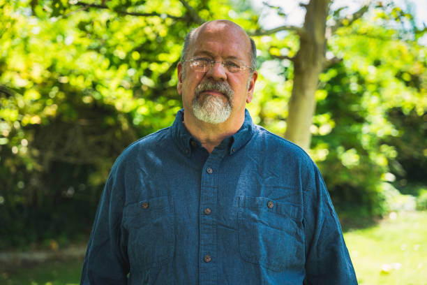 istock Middle Aged Man in Nature with a Hopeful Smile 1418059895